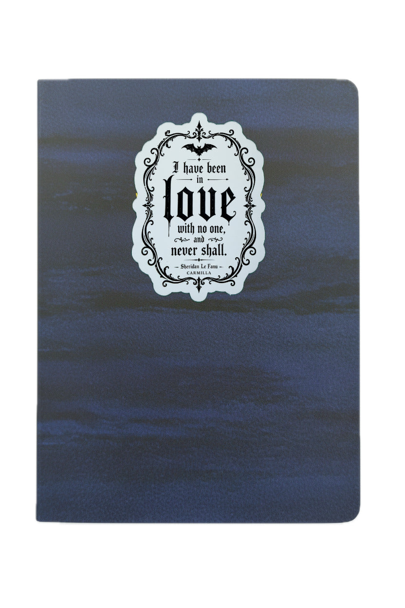 Blue notebook with a decorative label on a white background
