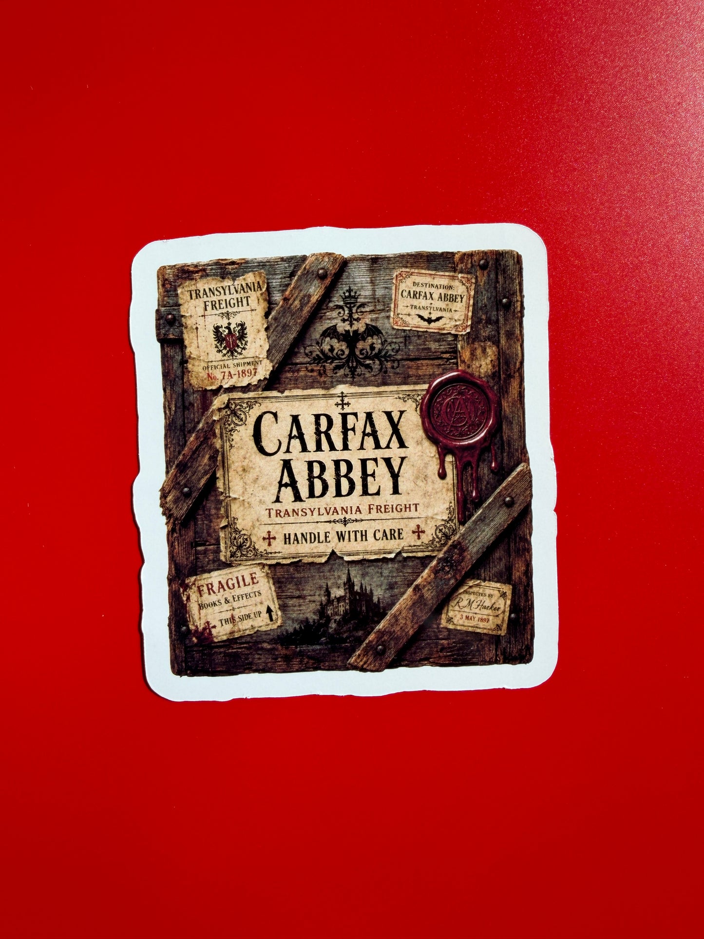 Sticker with Carax Abbey branding on a red background