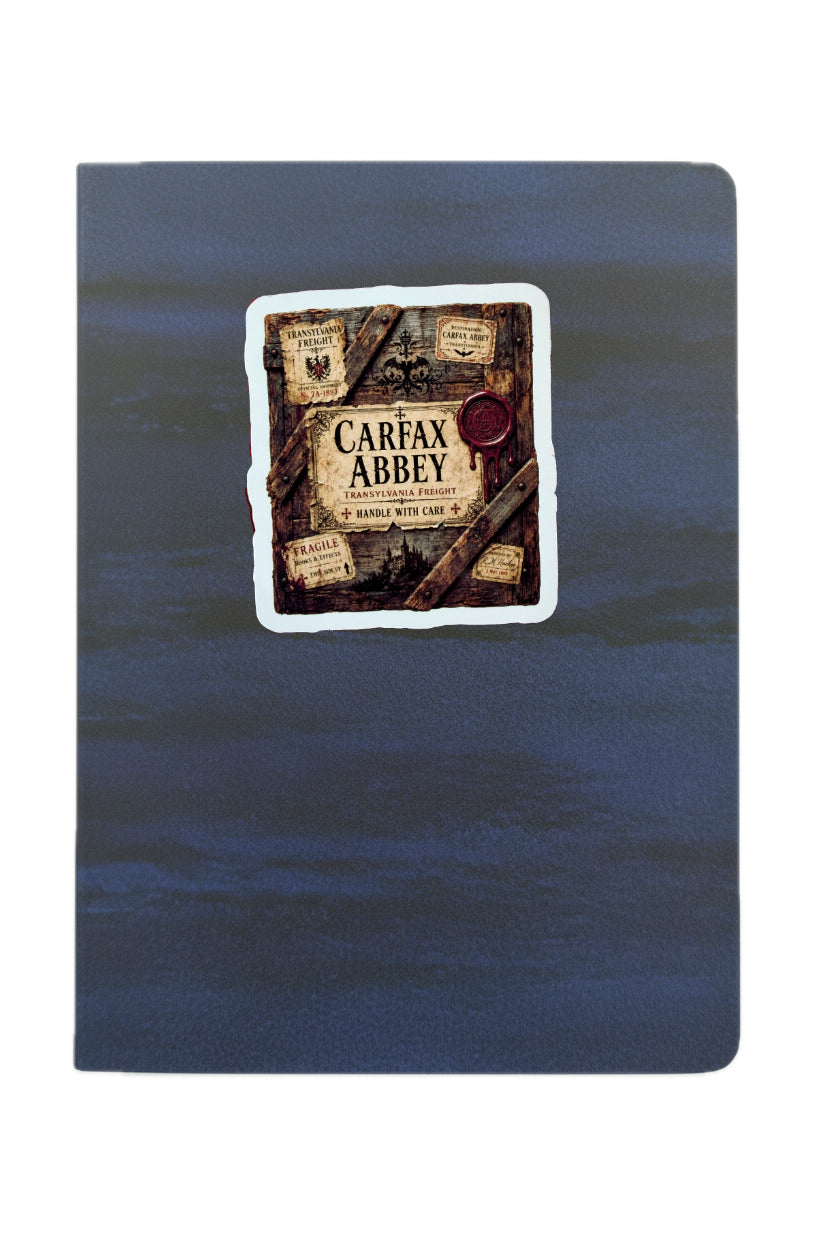 Blue notebook with a decorative label on a white background