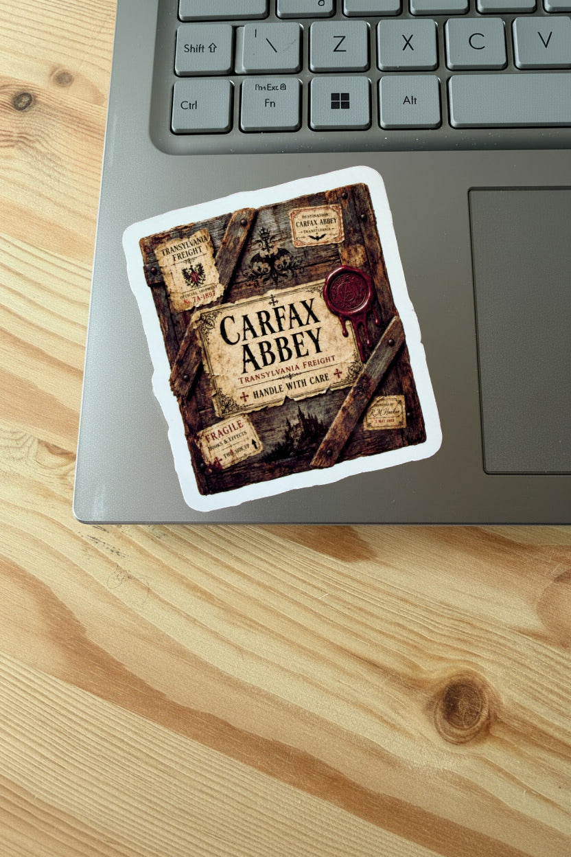 Sticker with 'Carfax Abbey' design on a laptop keyboard