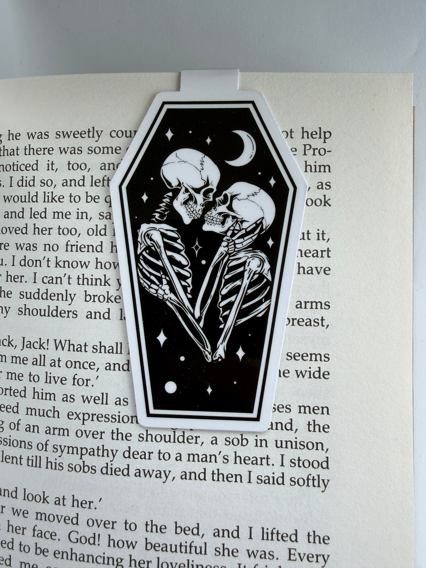 Skeleton couple illustration on a book page with text