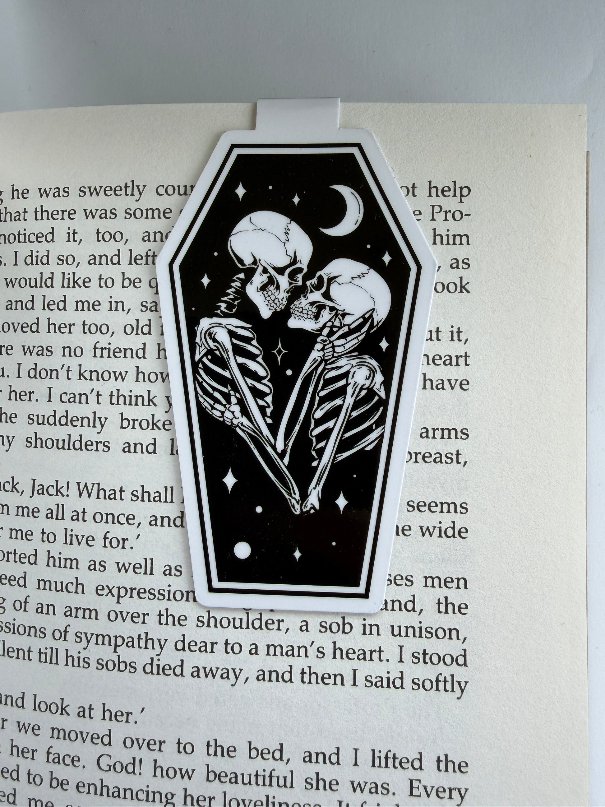 Skeleton couple illustration on a book page with text