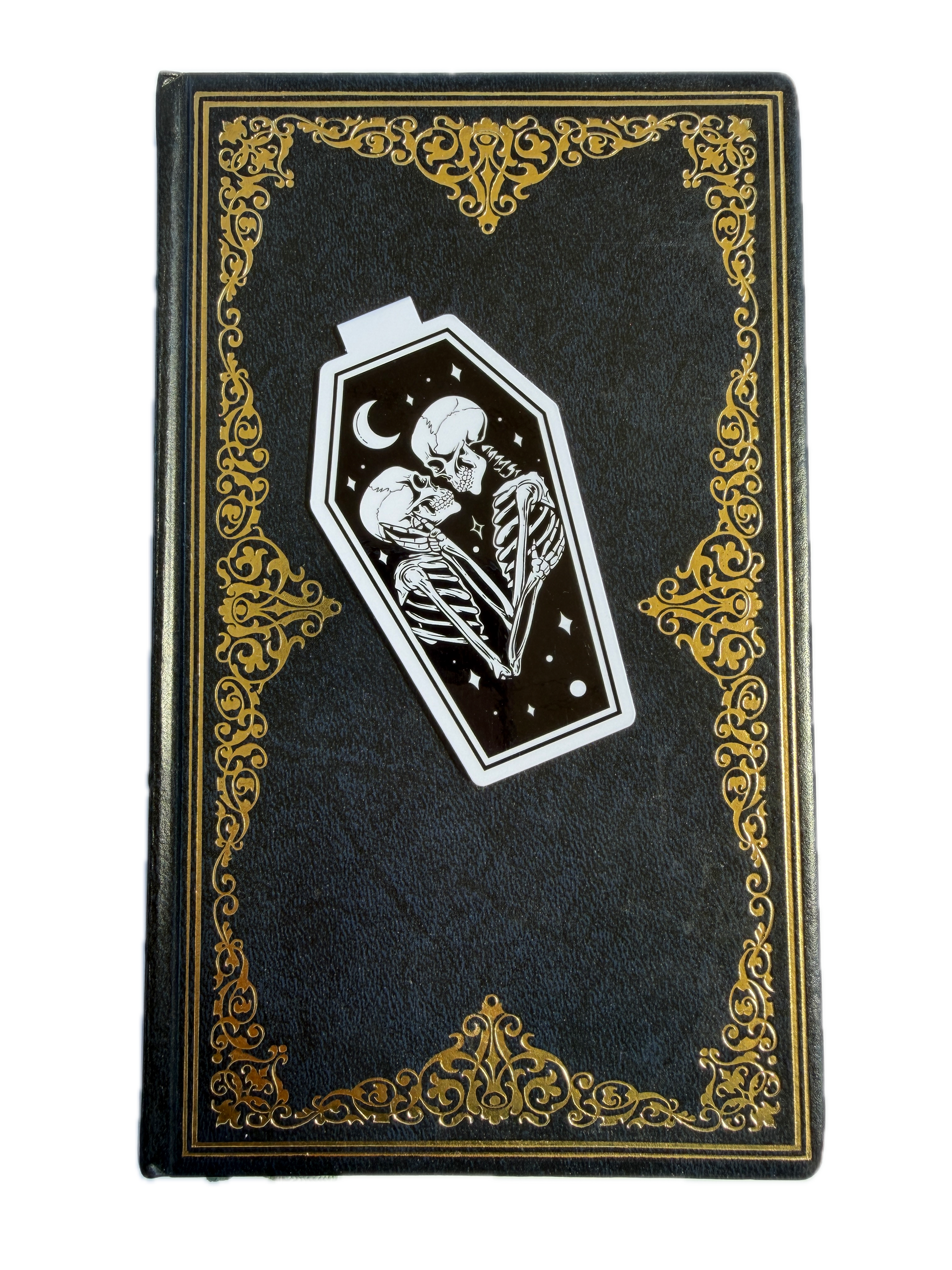 Decorative black box with gold accents and a white emblem featuring a skull and crescent moon.