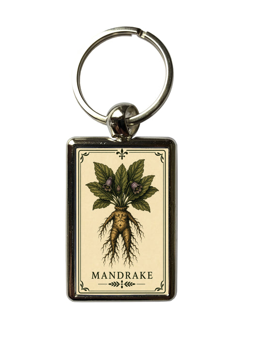Keychain with mandrake illustration on a beige background