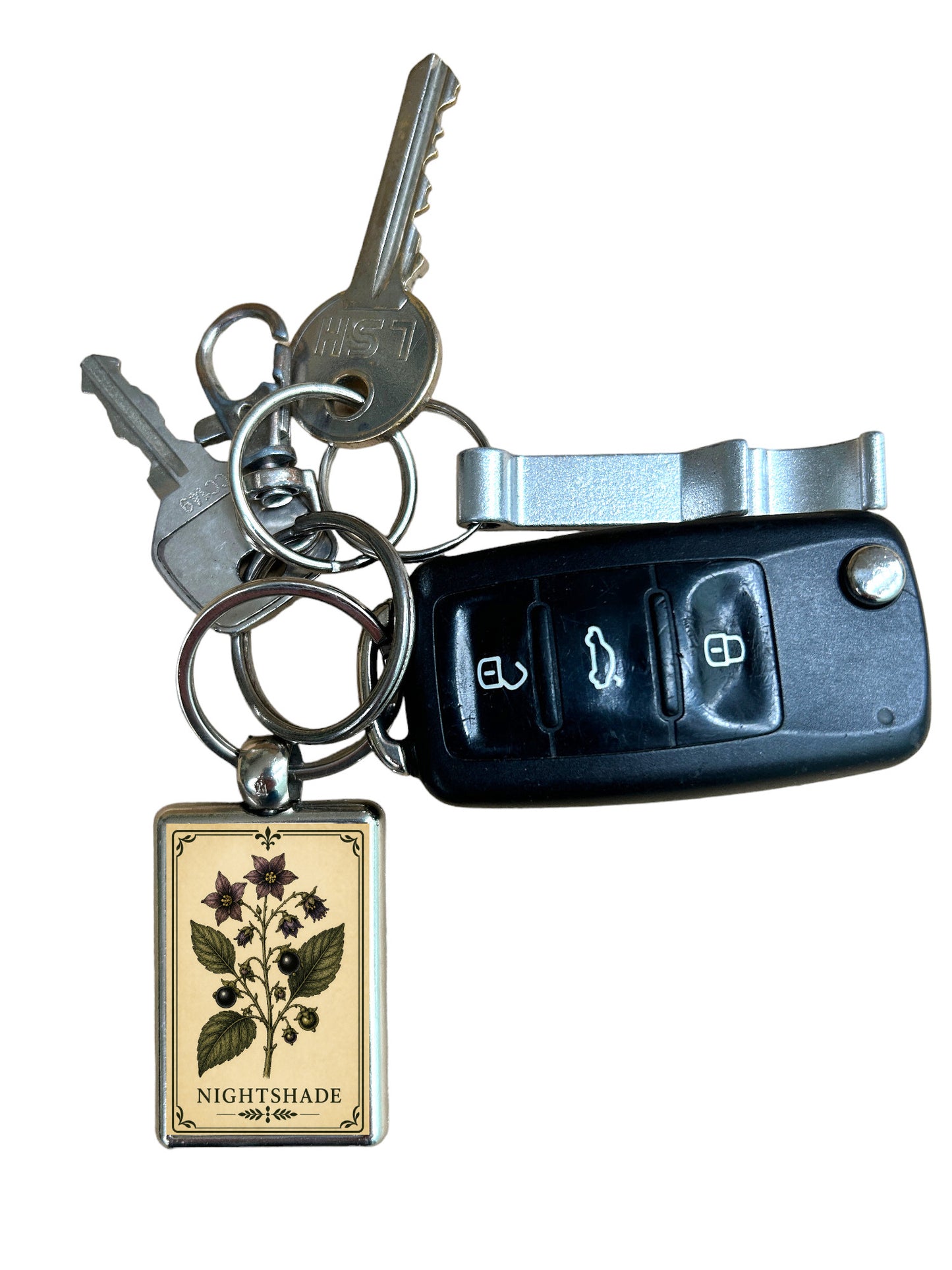 Keychain with 'Nightshade' charm and car key fob on a white background