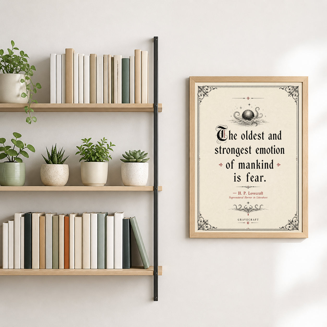 Bookshelf with books and plants next to a framed quote on a wall.
