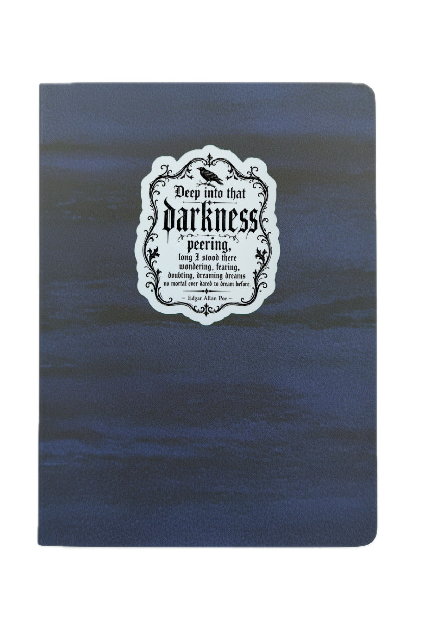 Blue notebook with a white label featuring text on a white background