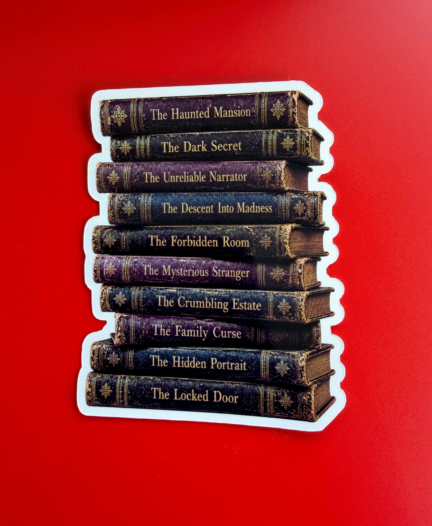 Stack of books with titles on a red background