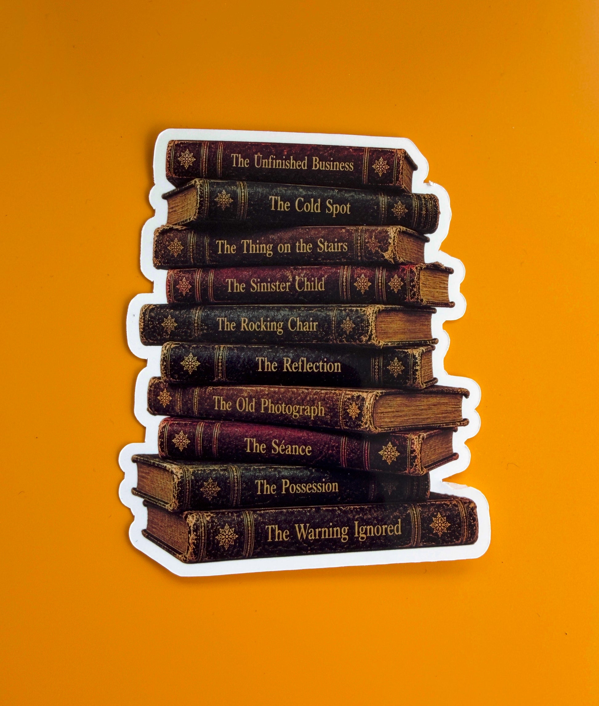 Stack of books with titles on a yellow background